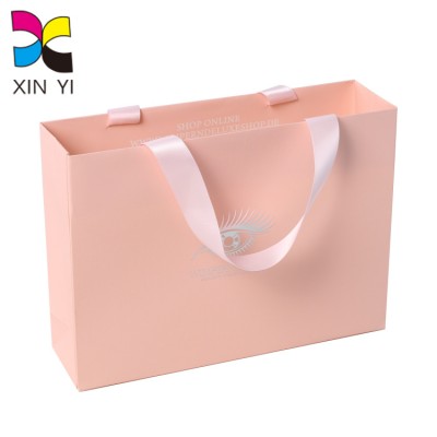 Guangzhou suppliers OEM luxury package pink logo printing packaging paper bags handles